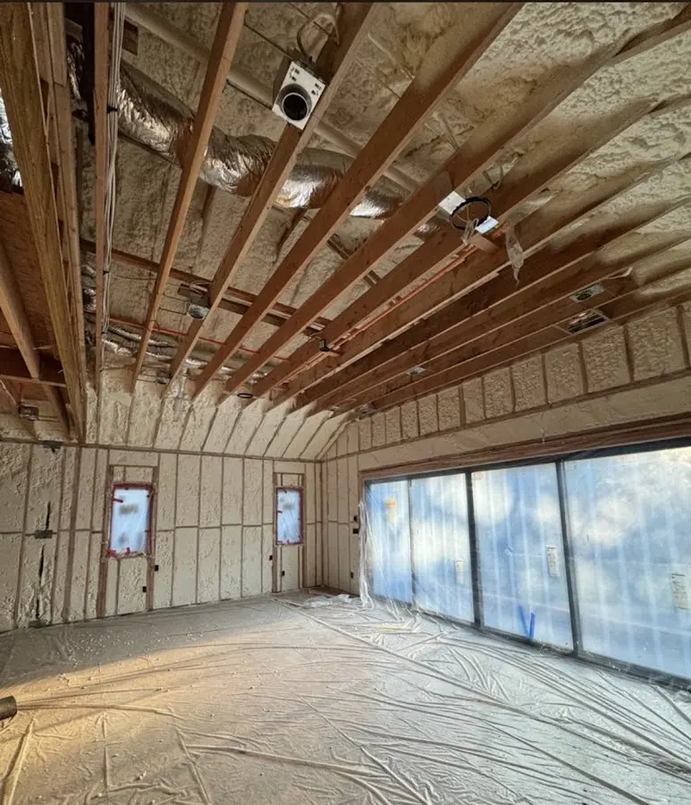 Interior walls and ceiling insulated with spray foam during new construction in Highland